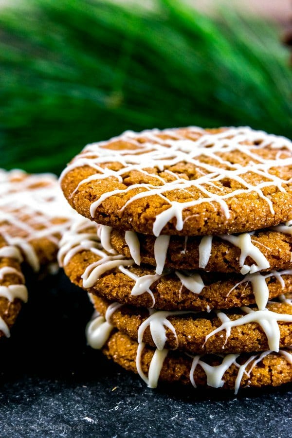 stacked gingersnap cookies with white chocolate drizzle