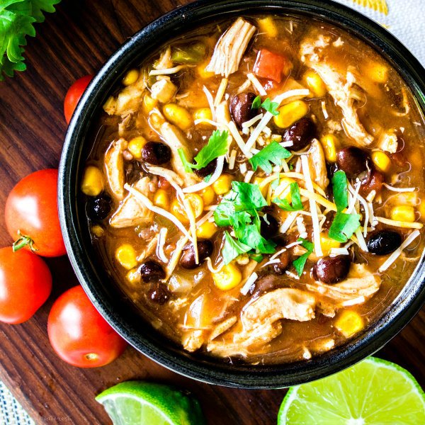Chicken Enchilada Soup with tomatoes and limes