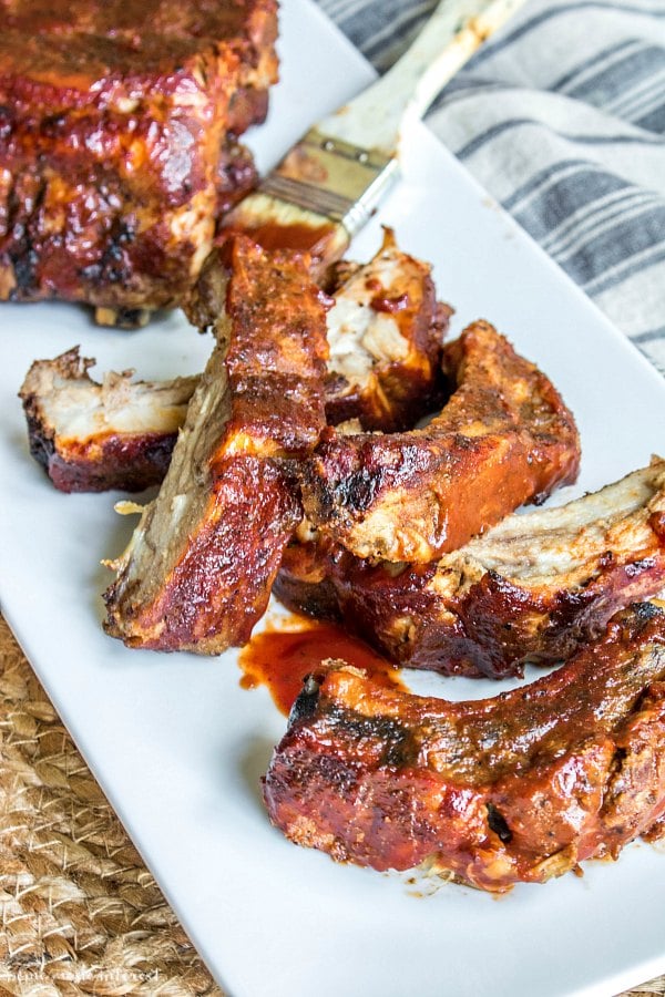 slow cooker bbq ribs cut into individual ribs on white platter