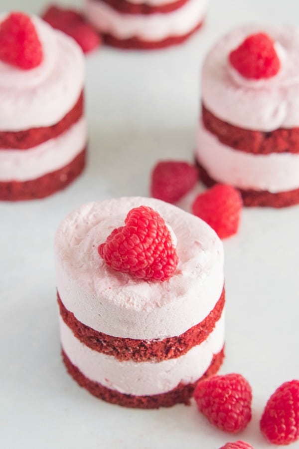 Mini Raspberry Mousse Red Velvet Cake with a fresh raspberry on top