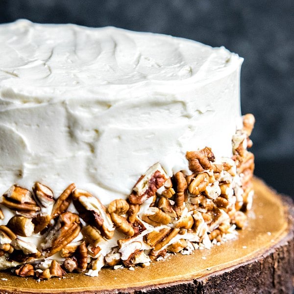 chopped pecans on the side of a Hummingbird Cake