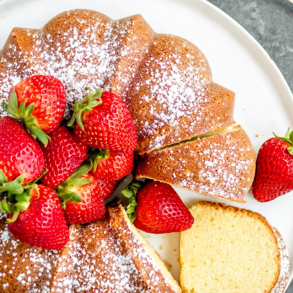 sour cream pound cake topped with fresh strawberries