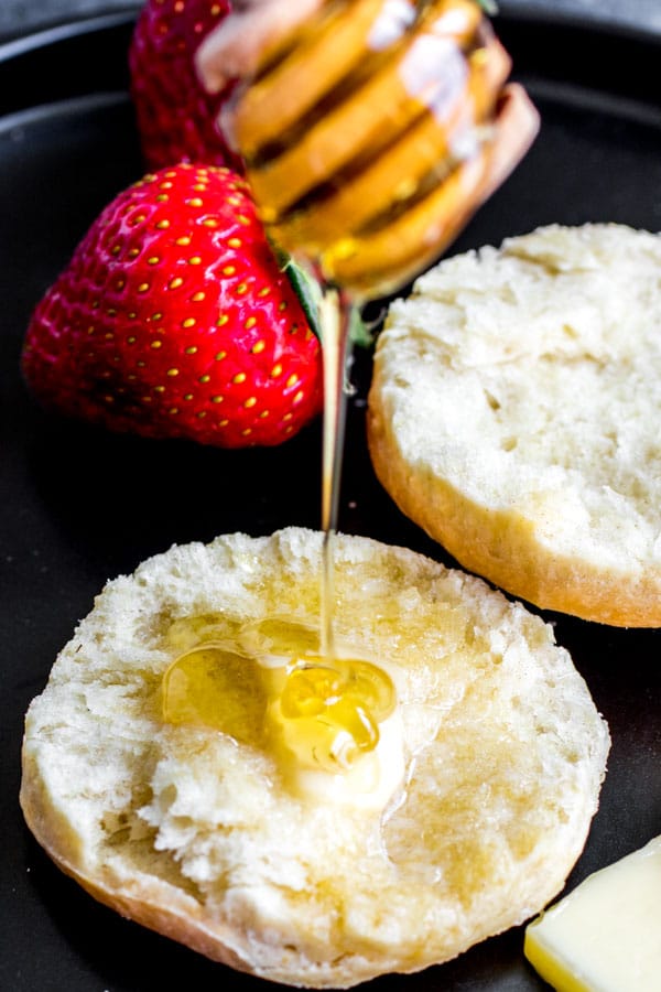 pouring honey on Baking Powder Biscuits