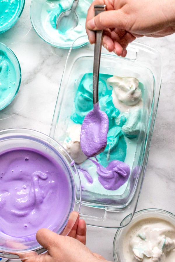No=churn mermaid ice cream going, different colors going into the container to be frozen