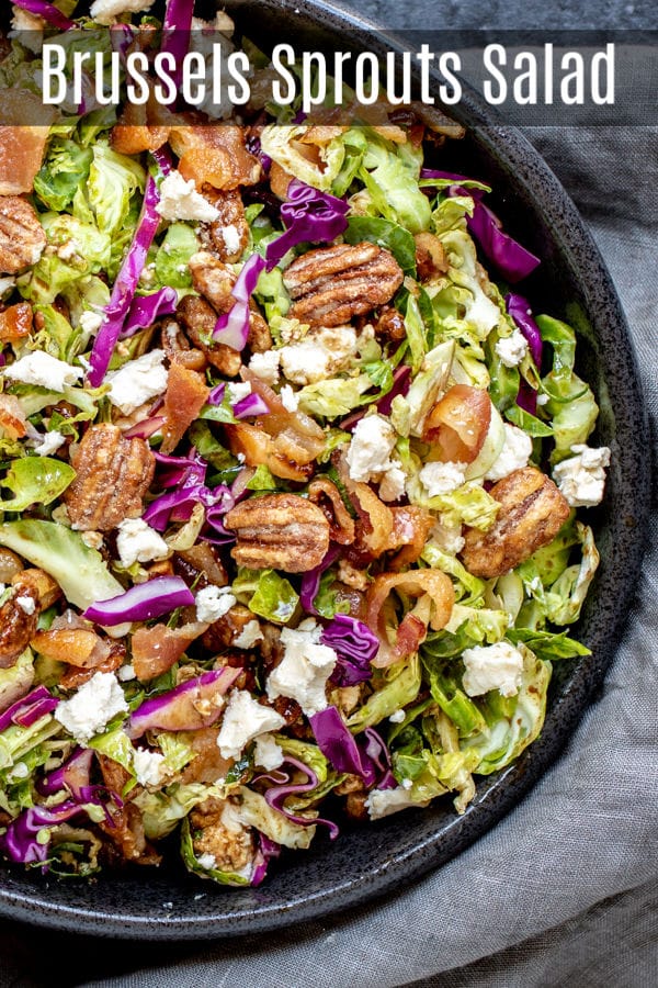 This easy Brussels Sprout Salad is filled with shaved or shredded Brussels sprouts, candied pecans, goat cheese, and bacon, tossed in a balsamic dressing. It is a raw Brussels sprout salad that is served cold. It is a delicious winter salad recipe that makes a delicious Thanksgiving side dish or Christmas side dish. #salad #brusselssprouts #thanksgiving #sidedish #christmas #pecan #homemadeinterest
