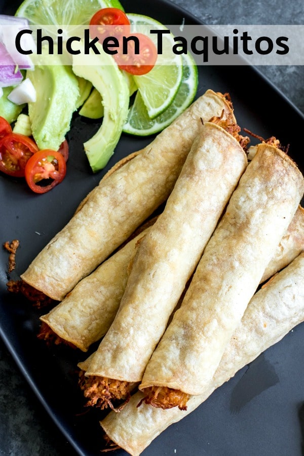 These easy, cheesy Chicken Taquitos are baked, not fried, and the corn tortillas are stuffed full of shredded chicken seasoning with homemade taco seasoning, and lots of cheese. Save time and make Crock pot shredded chicken or use a rotisserie chicken for this easy weeknight dinner recipe. #chicken #mexican #tortillas #taquitos #homemadeinterest #easyrecipes