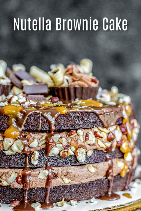 This is one of the best Nutella dessert recipes ever! Nutella Brownie Cake is layers of rich chocolate brownies, creamy Nutella frosting, toasted hazelnuts, and a smooth chocolate ganache. It is hands down the BEST cake for birthday parties and it makes a great Thanksgiving dessert, Christmas dessert, or New Year's Eve dessert! #cake #brownies #nutella #chocolate #christmas #newyears #thanksgiving #dessert #homemadeinterest