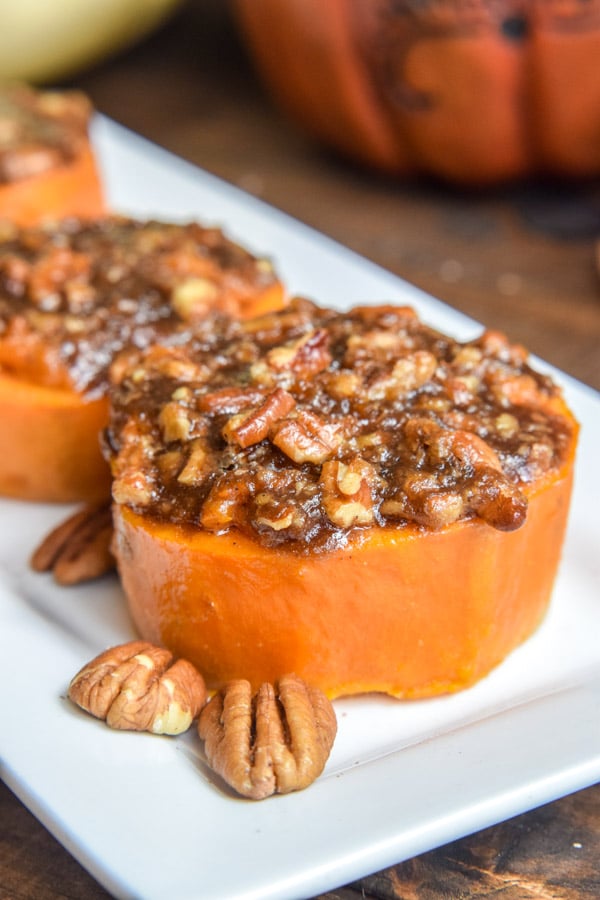 Mini Sweet Potato Casserole with brown sugar, pecans baked on top of 3 slices of sweet potato