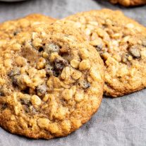 three chewy oatmeal raisin cookies stacked together