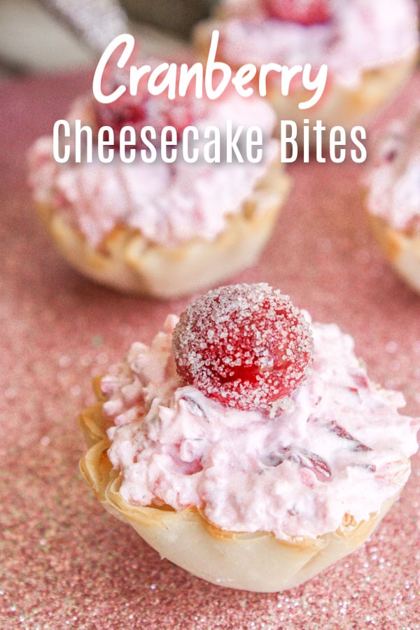 These delicious Cranberry Fluff Cheesecake Bites are an easy bite-size dessert filled with sweet cream cheese topped with light cranberry fluff. They are a no bake Christmas dessert recipe or Thanksgiving dessert, that is the perfect easy recipe for your holiday party. #christmas #thanksgiving #cranberries #dessert #cheesecake #bitesized #thanksgivingdesserts #christmasdesserts #homemadeinterest