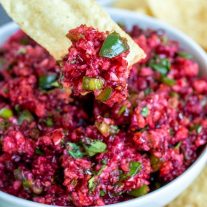 Mission tortilla chip with a scoop of Fresh cranberry salsa