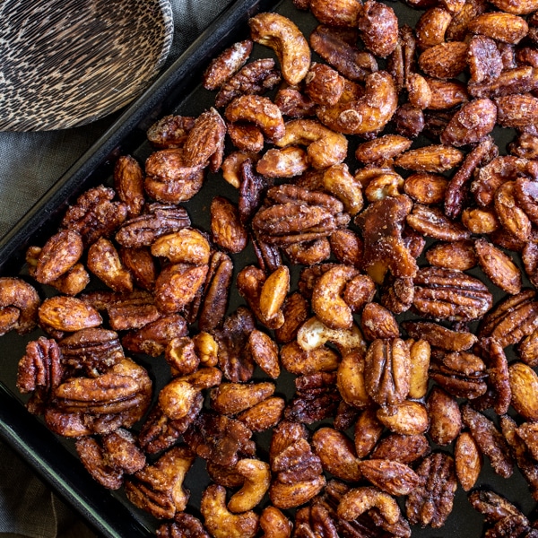 Slow Cooker Spiced Nuts on a baking sheet