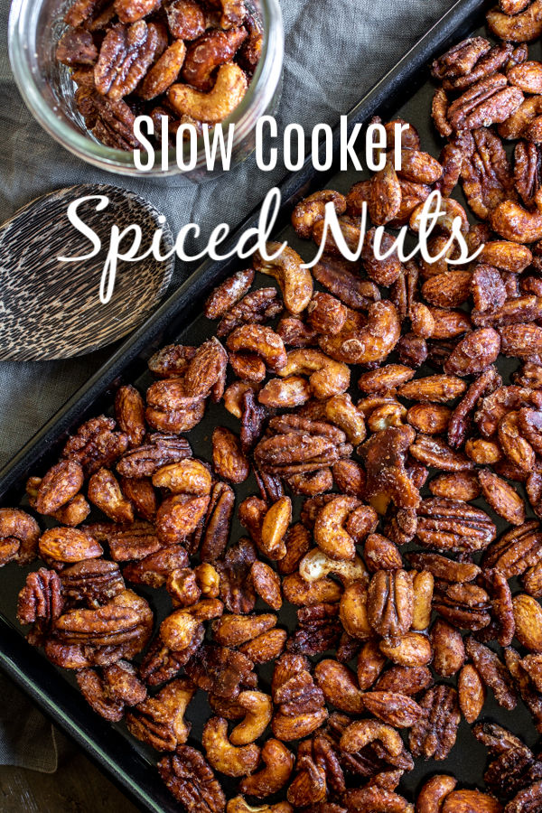 Sweet and spicy, these Slow Cooker Spiced Nuts are an easy holiday snack made with brown sugar and spices, slowly cooked in your De’Longhi Livenza Slow Cooker until the pecans, cashews, and almonds are candied. No eggs required! They make a great Christmas gift for friends and family. AD #delonghi #livewell #christmas #christmasrecipes #pecans #candiedpecans #almonds #cashews #snackmix #homemadeinterest