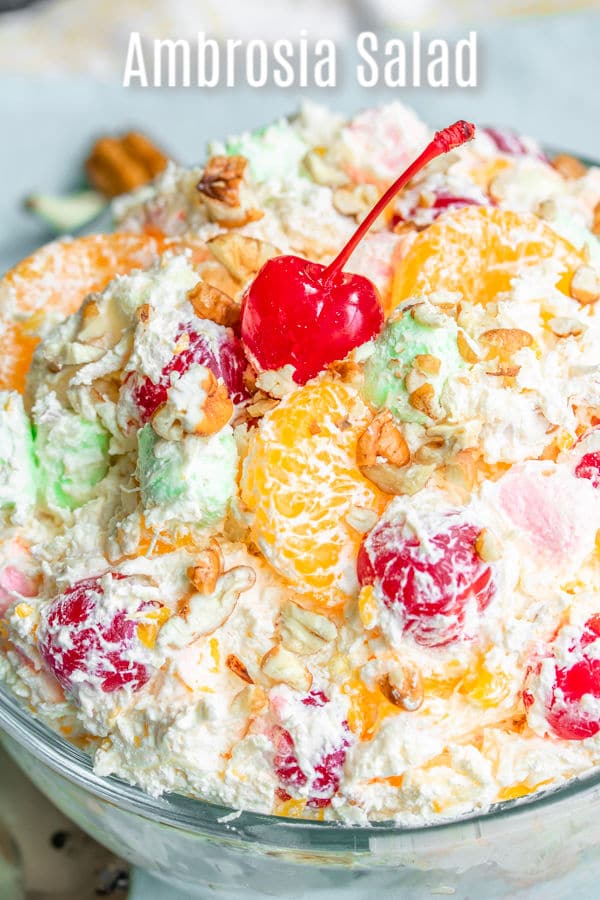 Light and fluffy Ambrosia Salad is a classic southern dessert made with Cool Whip and sour cream tossed with fruit, coconut and marshmallows. It's an easy, old-fashioned recipe for a delicious marshmallow fruit salad that can be served at Easter dinner, Mother's Day brunch, Thanksgiving dinner, or Christmas dinner. #ambrosia #marshmallows #easter #mothersday #fruitsalad #homemadeinterest