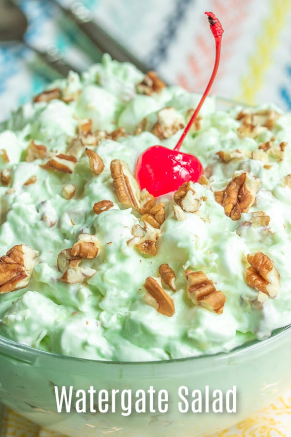 This easy Watergate Salad recipe is a deep south, classic recipe, made like the original with Cool Whip, pineapple, pistachio pudding, marshmallows, and chopped nuts. It's the best, make ahead dessert recipe and it's perfect for summer pot lucks and holiday dinners. Make it for Easter dinner, Thanksgiving dinner, or Christmas dinner. #easter #thanksgiving #christmas #pistachio #watergate #coolwhip #nobake #marshmallows