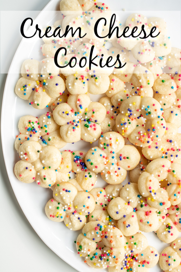 These easy Cream Cheese Cookies are soft, delicious cookies that are perfect for Easter, Mother's Day, or Christmas! Make these pretty little cream cheese cookies with a cookie press and top with sprinkles for simple, classic cookies that are perfectly tender every time. #cookies #creamcheese #baking #sweettreats #dessert #Easter #mothersday #christmas #homemadeinterest
