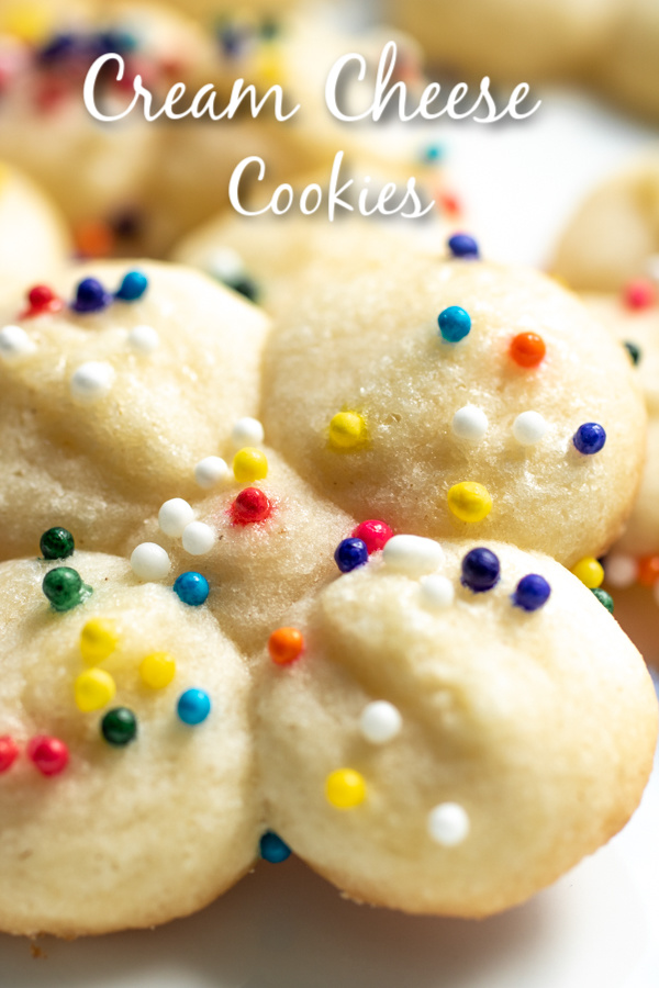 These easy Cream Cheese Cookies are soft, delicious cookies that are perfect for Easter, Mother's Day, or Christmas! Make these pretty little cream cheese cookies with a cookie press and top with sprinkles for simple, classic cookies that are perfectly tender every time. #cookies #creamcheese #baking #sweettreats #dessert #Easter #mothersday #christmas #homemadeinterest
