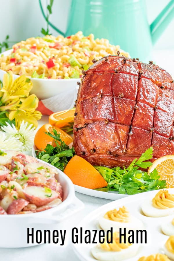 Honey Glazed Ham is an easy recipe for baked ham with a glaze made form honey, brown sugar, ginger, and orange zest. Bake your spiral ham or whole fully-cooked ham, bone-in or boneless in the oven with this delicious sweet glaze. It's the best honey glazed ham recipe you can make for Easter dinner or Christmas dinner! #ham #honey #Easter #Christmas #easydinnerrecipes #homemadeinterest