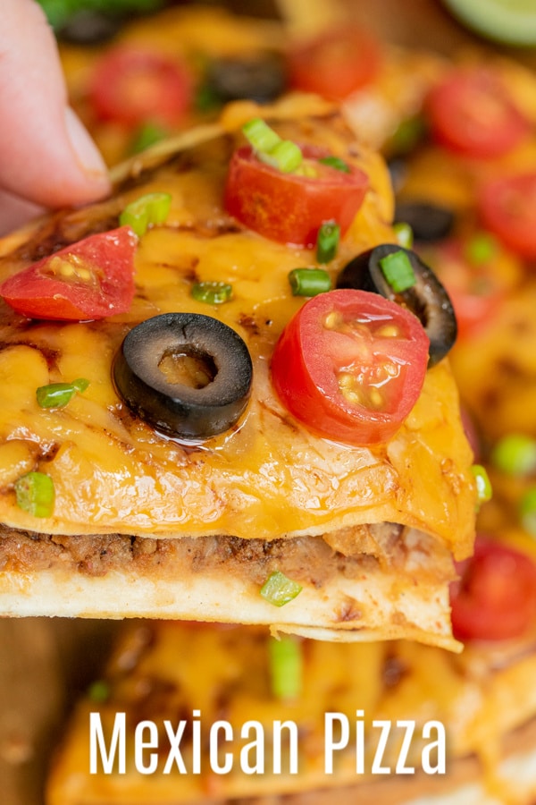 Celebrate Cinco de Mayo with a Mexican Pizza fiesta. This homemade Mexican Pizza is made with two crisp tortillas, refried beans, and seasoned ground beef, topped with sauce, cheese and baked until crisp, and topped with your favorite fresh toppings. It is an easy lunch or dinner recipe that is makes a great Cinco de Mayo recipe. AD #cincodemayo #groundbeef #pizza #mexicanfood #homemadeinterest