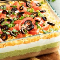 7 Layer Dip layered with beans, guacamole and sour cream