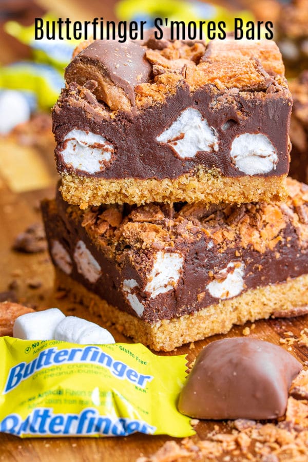 These easy Butterfinger S'mores Bars are semi-no bake s'mores with a golden graham cracker crust, a thick layer of marshmallow fudge, topped with crispety, crunchety, peanut-buttery Butterfinger Minis on top. It's a chocolate dessert bar perfect for summer parties, potlucks, or camping. It's the BEST s'mores recipe you'll ever make! #ad #betterbutterfinger #smores #chocolate #grahamcracker #dessert #homemadeinterest