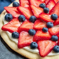 Red, White & Blue Fruit Pizza layered with strawberries and blueberries