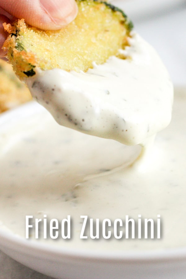 This recipe for Crispy Fried Zucchini is deep fried in a skillet for crisp zucchini chips made with panko bread crumbs, batter, and served with a lemon aioli dipping sauce. It's an easy and delicious zucchini recipe that makes a great appetizer. #zucchini #fried #panko #appetizer #homemadeinterest