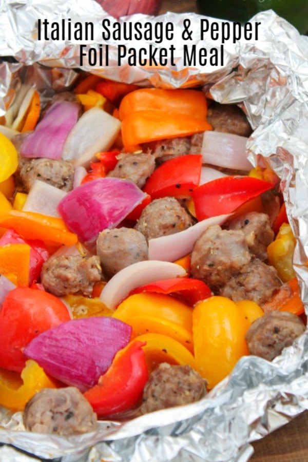 These easy sausage foil packets for the grill are made with Italian Sausage, bell peppers, and onions. It's an easy foil packet dinner or hobo dinner, that is perfect for family dinner, or camping. #hobodinners #foilpacket #grilling #grilled #sausage #peppers #homemadeinterest