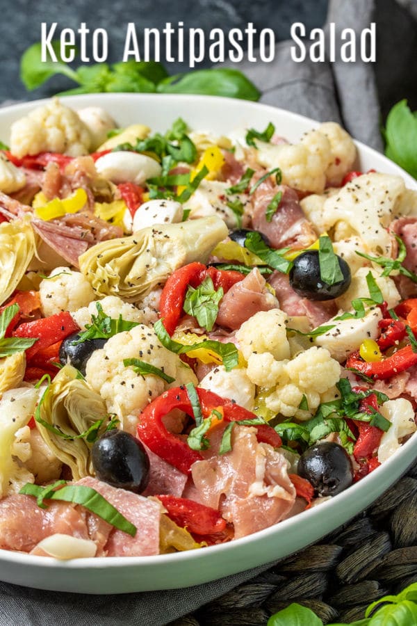 This easy keto antipasto salad is a low carb side dish that is packed full of Italian flavor. This healthy antipasto recipe is made with cauliflower, salami, prosciutto, Italian vegetables, and homemade dressing for a delicious appetizer or side dish that is perfect for a crowd. #homemadeinterest #ketodiet #ketorecipes #lowcarb #lowcarbdiet #antipasto #Italian #cauliflower