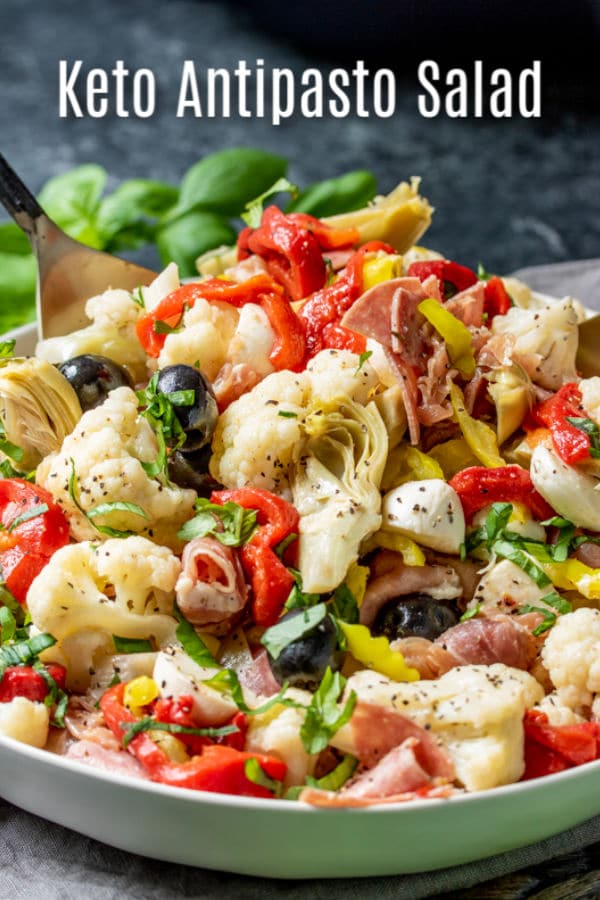 This easy keto antipasto salad is a low carb side dish that is packed full of Italian flavor. This healthy antipasto recipe is made with cauliflower, salami, prosciutto, Italian vegetables, and homemade dressing for a delicious appetizer or side dish that is perfect for a crowd. #homemadeinterest #ketodiet #ketorecipes #lowcarb #lowcarbdiet #antipasto #Italian #cauliflower
