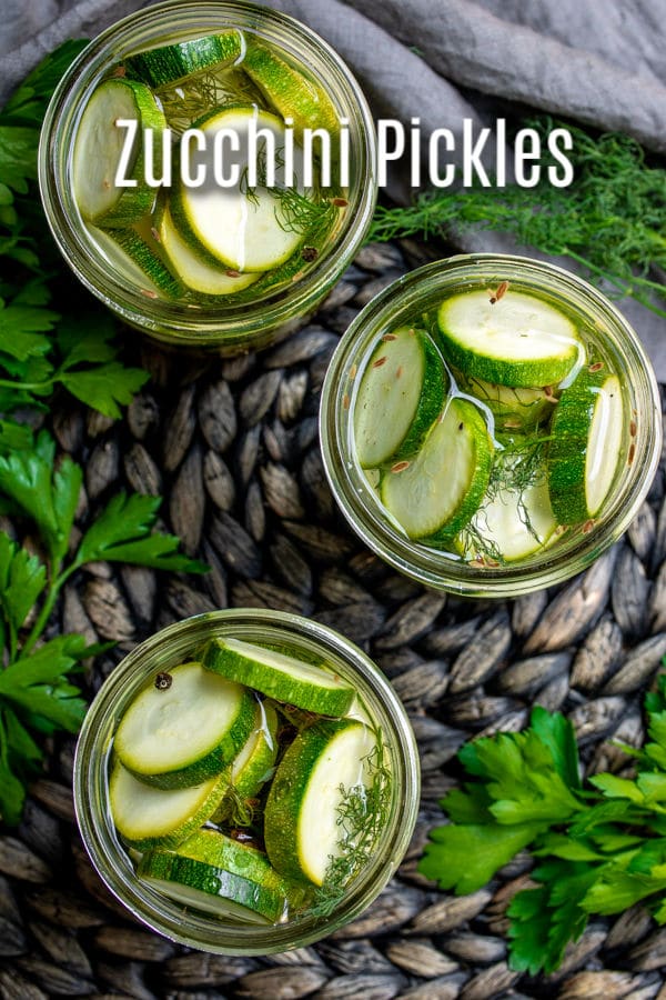 Refrigerator Zucchini Pickles are a simple pickled vegetable recipe that is the perfect way to use up that summer zucchini. No sugar added so they make a great keto snack! We'll show you how to make zucchini pickles with fresh zucchini instead of cucumbers and mixed with fresh garlic, dill, and spices to make a delicious dill brine. A quick and easy pickled vegetable recipe made in mason jars! #zucchini #pickles #brine #dill #homemadeinterest