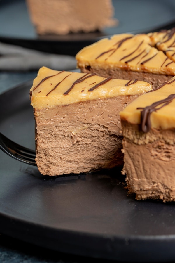slice of Low Carb Chocolate Cheesecake topped with keto peanut butter mousse