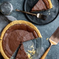 whole Chocolate Chess Pie and slice on plate