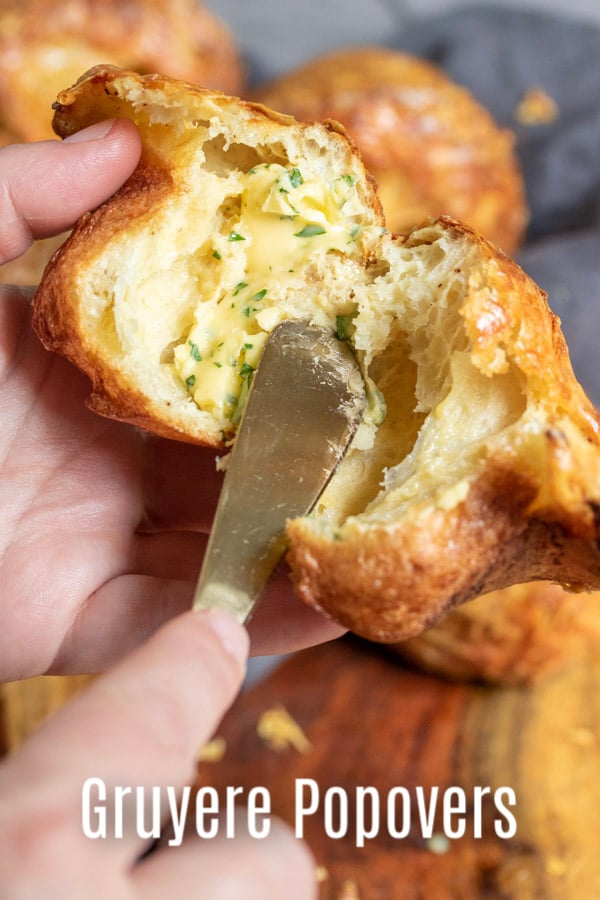 These easy Gruyere Popovers are a fluffy, cheesy popover recipe that make a great addition to Thanksgiving dinner or Christmas dinner! These cheesy popovers are a savory bread recipe that is easy to make and always impresses guests! #bread #popovers #cheese #thanksgiving #christmas #rolls #baking #homemadeinterest