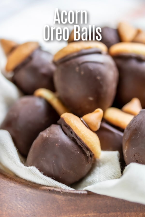 These Acorn Oreo Balls are an easy no bake recipe made with crushed oreos and cream cheese dipped in chocolate and decorated to look like an acorn. It's a fun fall dessert that makes a great school treat, or Thanksgiving dessert. We've got simple instructions for how to make Oreo balls that you can use for any occasion. #oreo #oreoballs #thanksgivingdessert #dessert #cookies #homemadeinterest