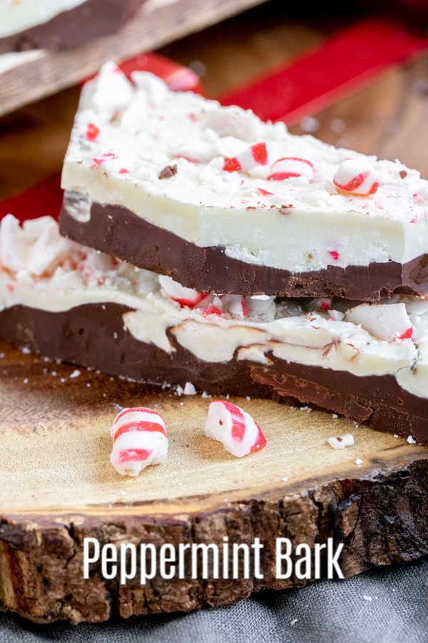 This easy recipe for peppermint bark is made with white chocolate and dark chocolate layered together with crunchy, crushed peppermint candy. It's the BEST homemade Christmas candy and peppermint bark is one of my favorite edible gifts to give out during the holidays! #chocolate #peppermint #Christmas #candy #gift #homemadeinterest