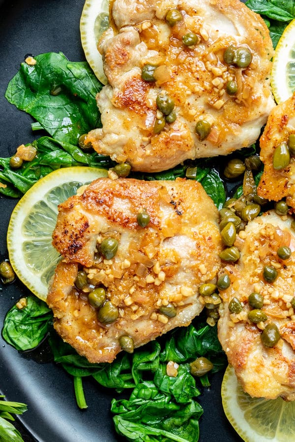 Chicken Piccata on a bed of spinach with capers