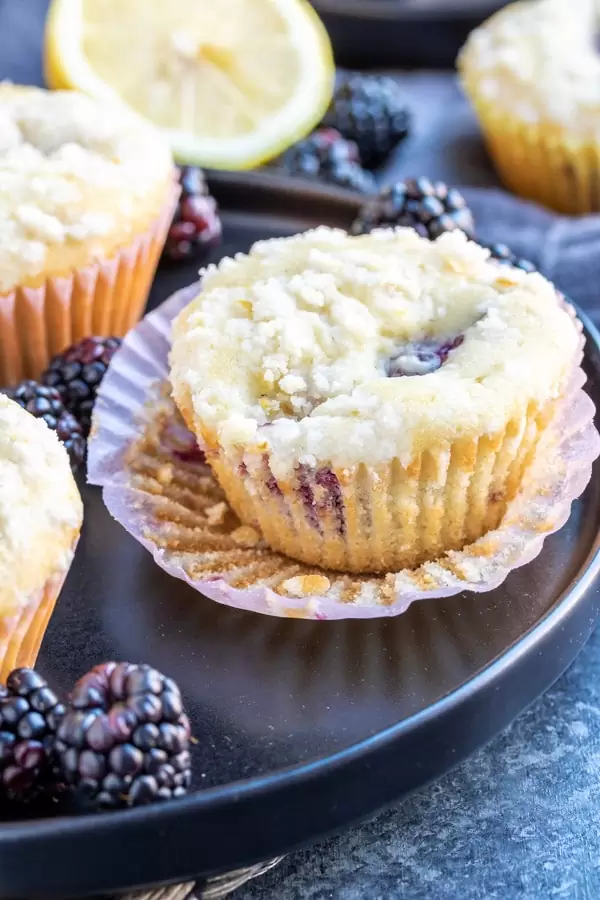Blackberry Lemon Muffins in cupcake liner on a plate