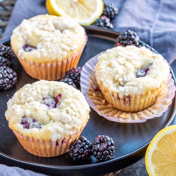 plate with Blackberry Lemon Muffins with blackberries