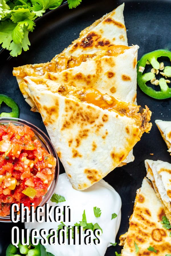 These easy chicken quesadillas are buttery, toasted flour tortillas packed full of grilled chicken and perfectly melted cheese. Chicken quesadillas are grilled in a skillet to make the perfect comfort food. It's an easy lunch or dinner recipes that kids and adults will love. They are a simple Cinco de Mayo dinner recipe!