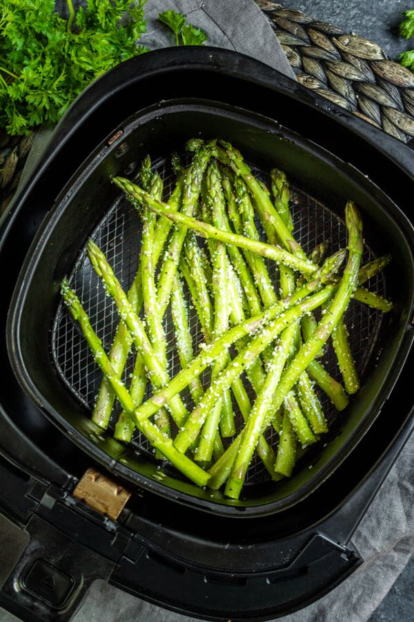 Air Fryer Asparagus in air fryer basket