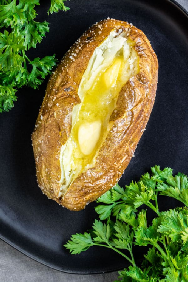 Air Fryer Baked Potato with butter on plate