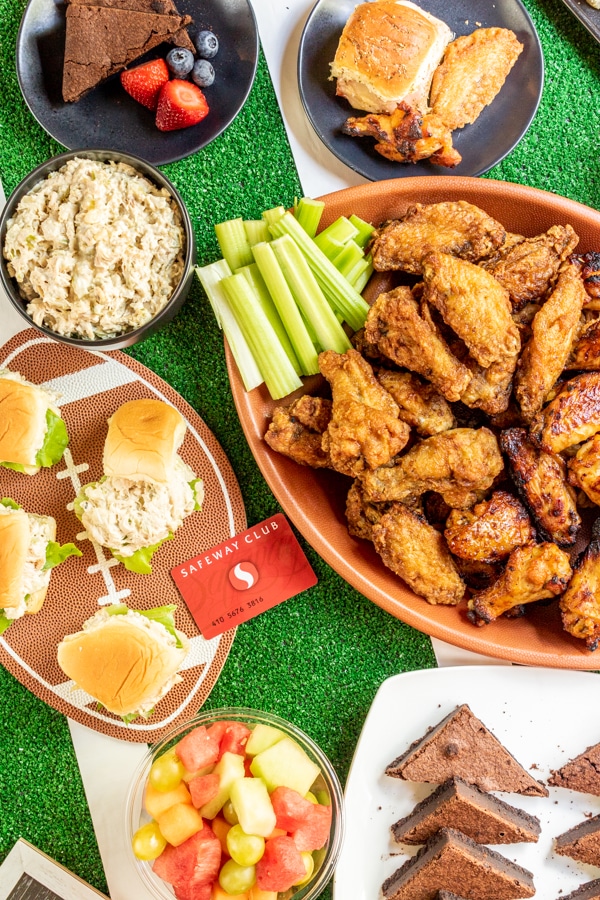 Top down view of football party food table  with Safeway Club card