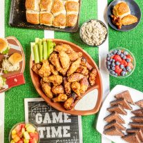 Game day food table with sliders, wings, and more