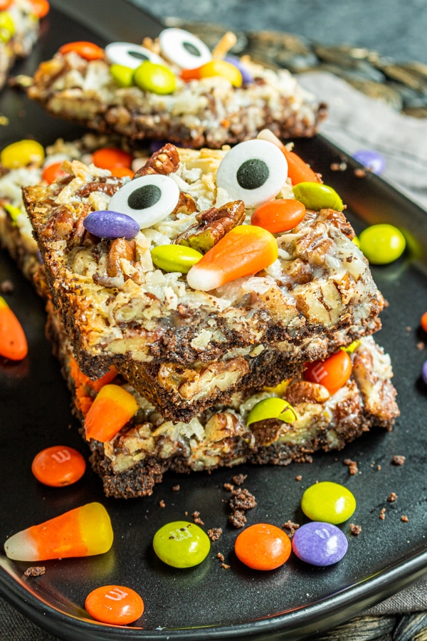 stacked Halloween Magic Cookie Bars on a plate