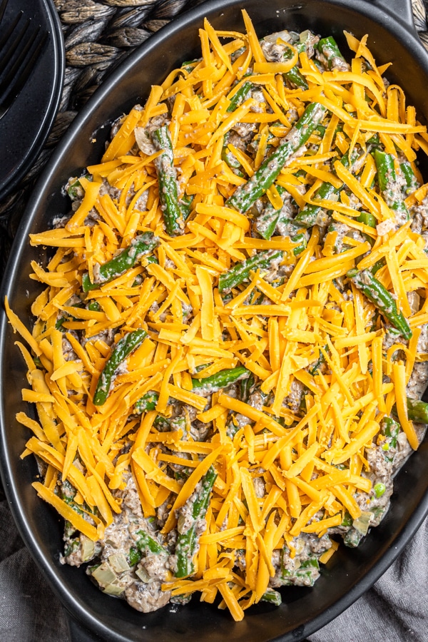 Keto Green Bean Casserole with cheddar cheese on top