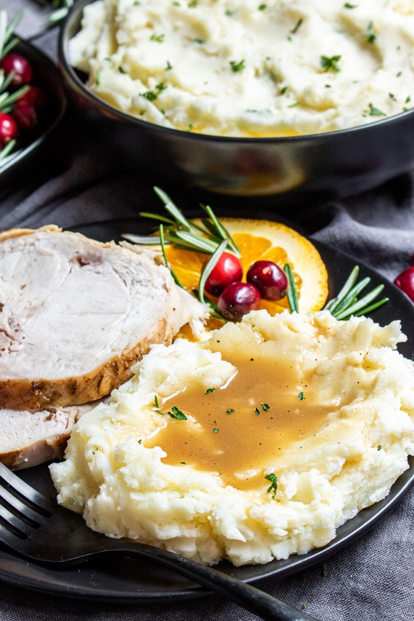 plate with Instant Pot Mashed Potatoes and gravy