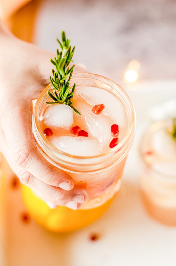 holding Christmas Punch in a mason jar