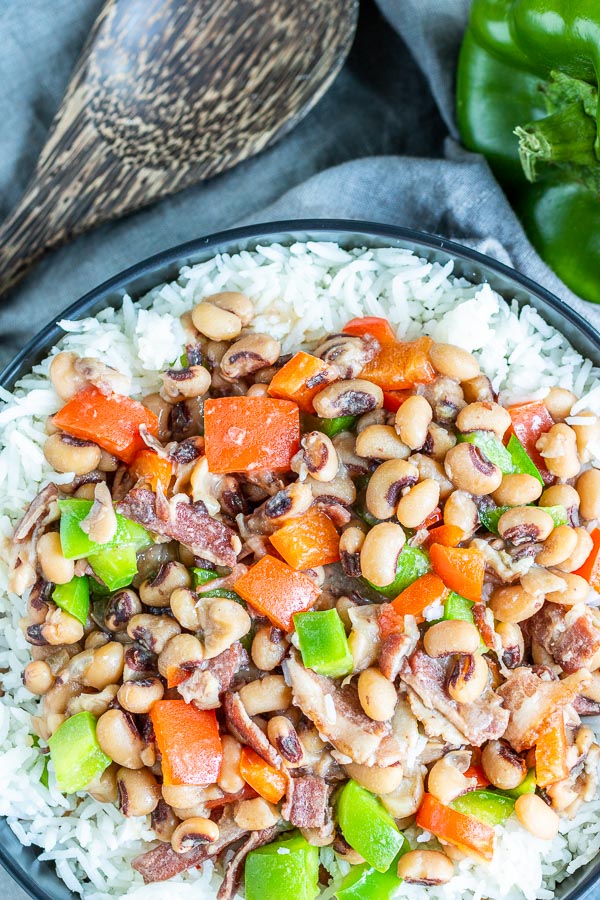 Instant Pot Hoppin' John in a bowl with wooden spoon