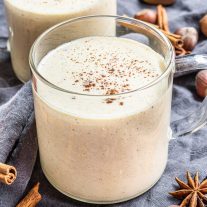 Keto Eggnog in a cup with cinnamon on top